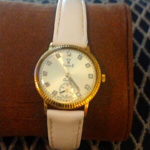 18 karat gold case watch with diamond bezel setting